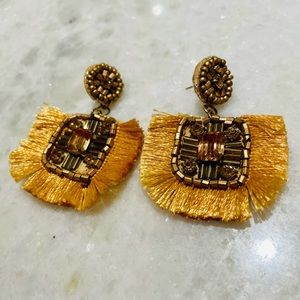 Gold statement earrings with fringe detail